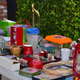 Garage sale table full of decor and kitchen items